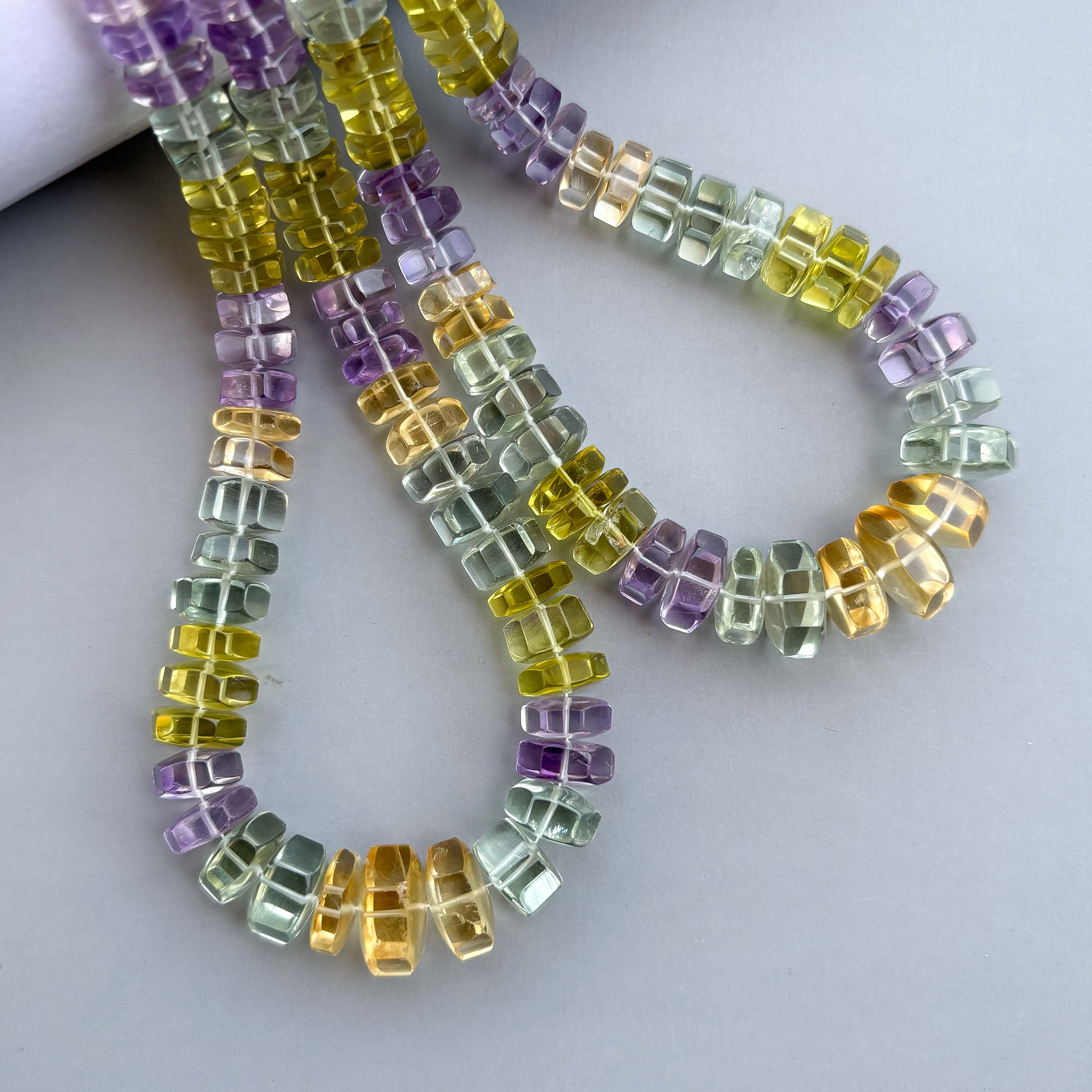 Multi gemstone hexagon bolt beads with faceted finish

