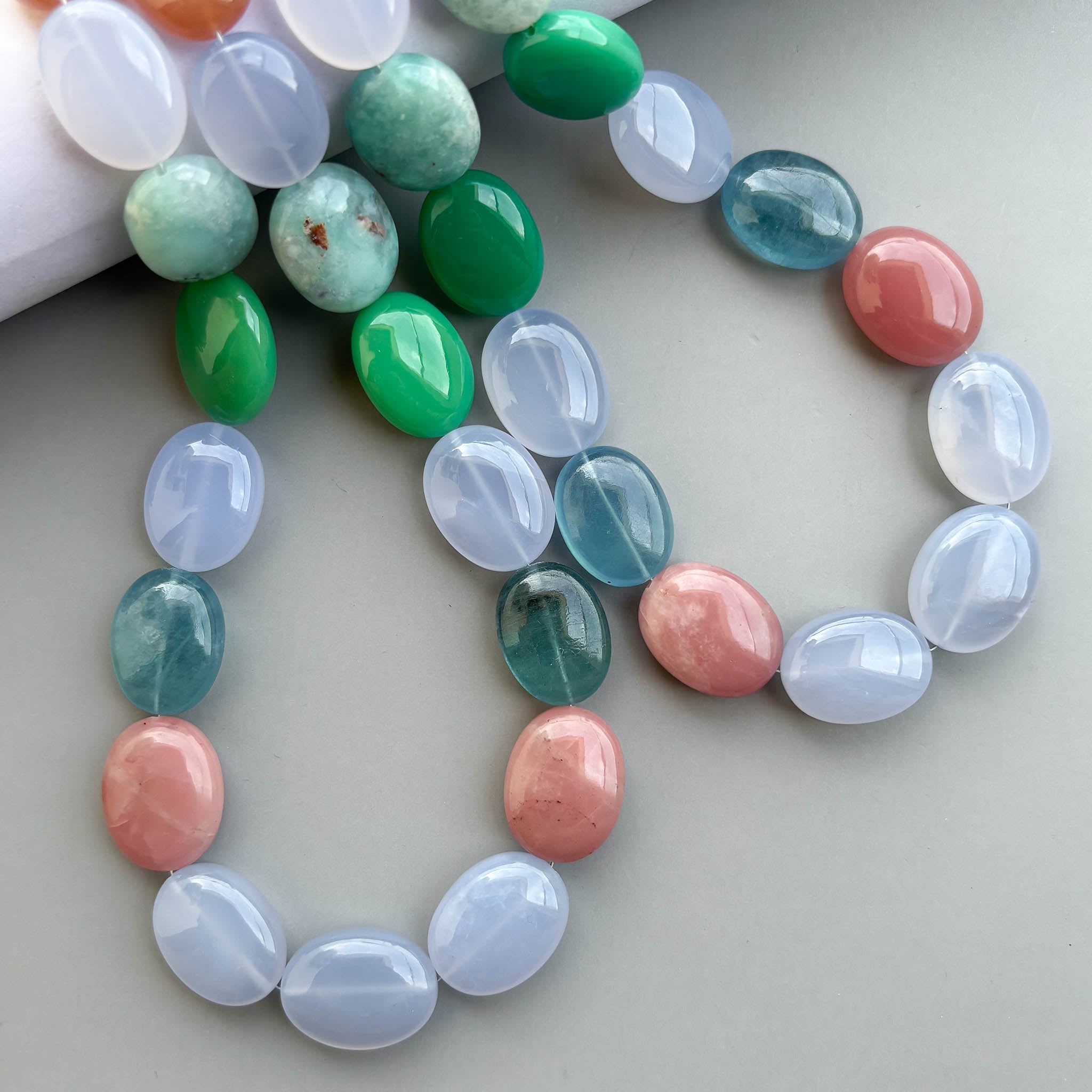Mixed semi-precious gemstone smooth oval beads in assorted colors