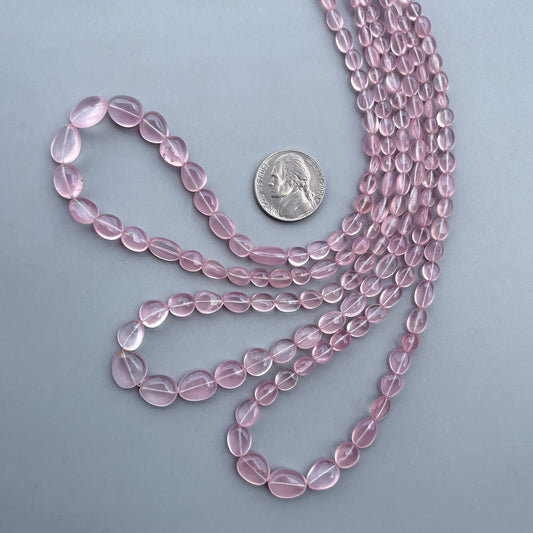 Small natural rose quartz nugget beads with soft pink color