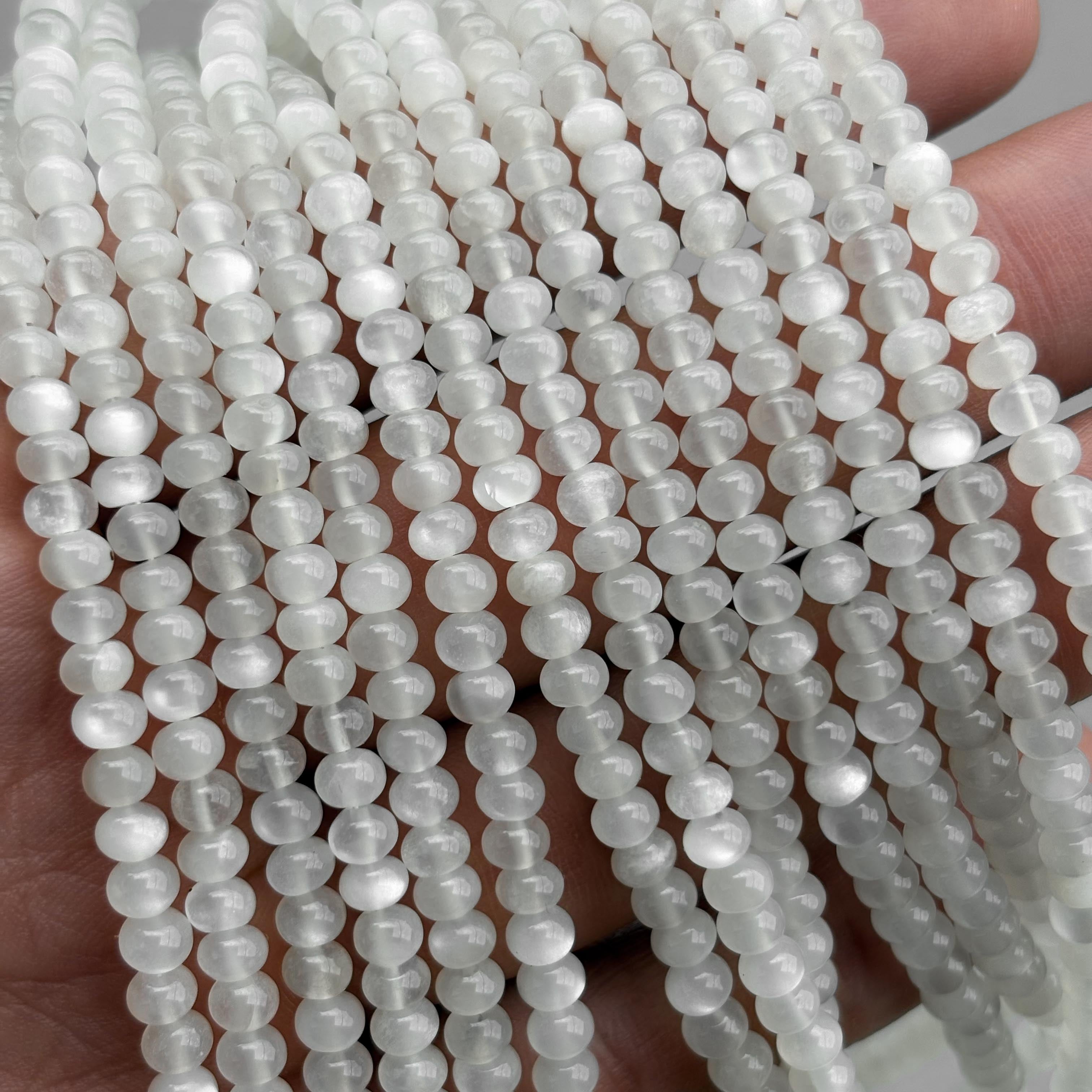 Natural white moonstone smooth rondelle beads strand close-up