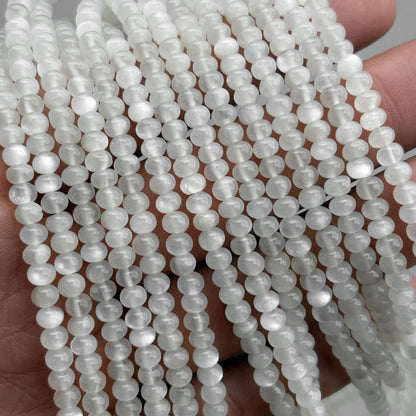 Natural white moonstone smooth rondelle beads strand close-up