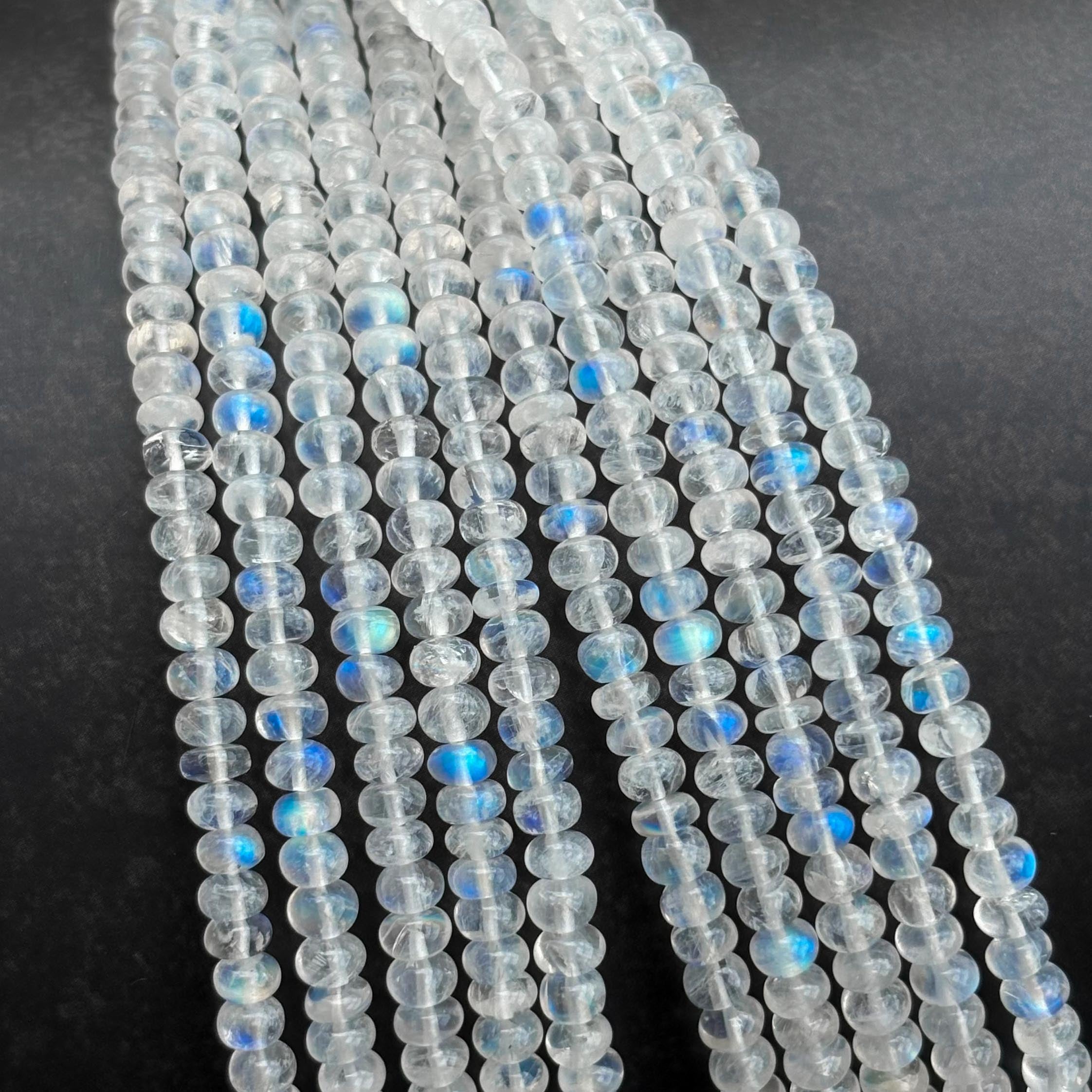 Natural rainbow moonstone smooth rondelle beads strand close-up