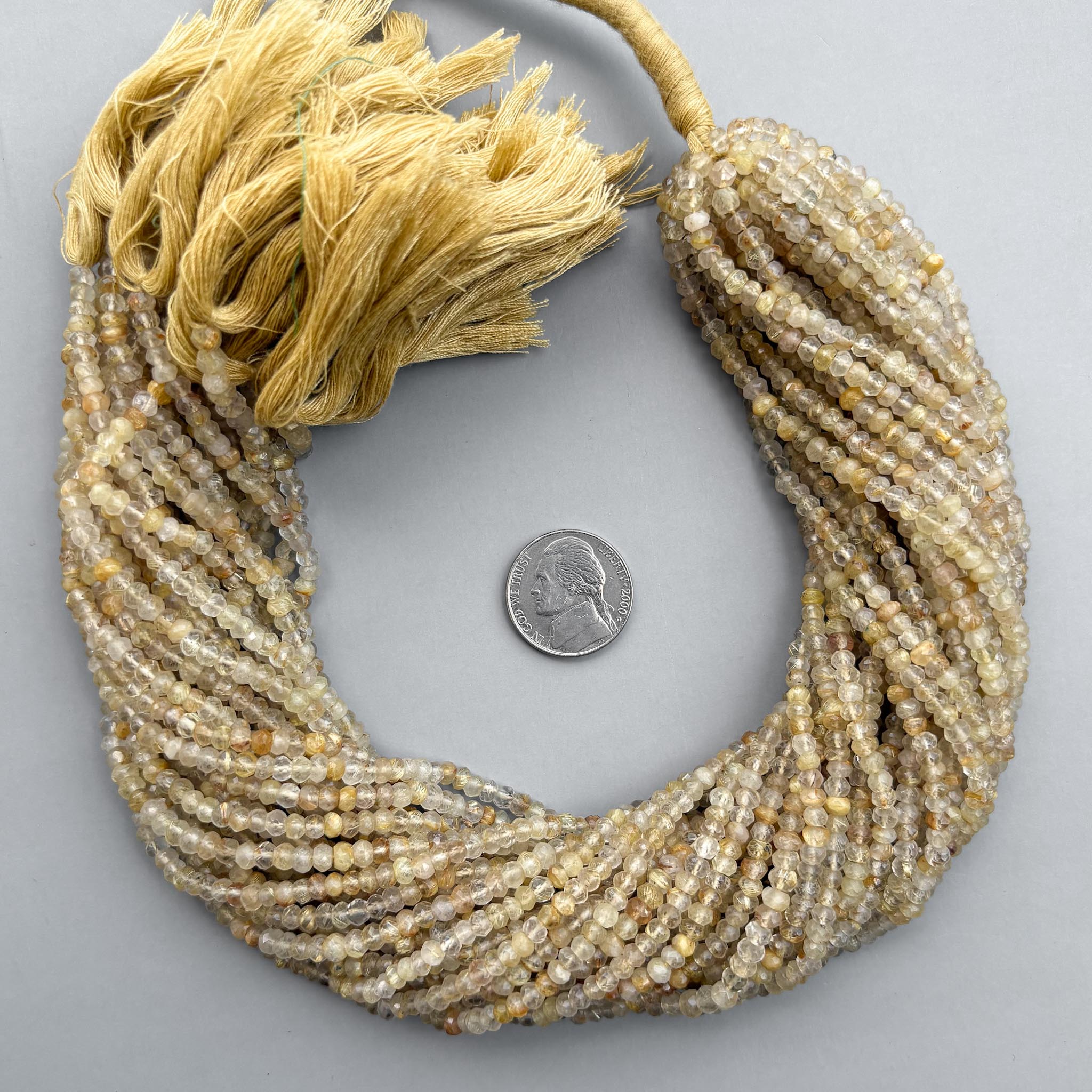 Golden rutile quartz beads with fine golden needle inclusions