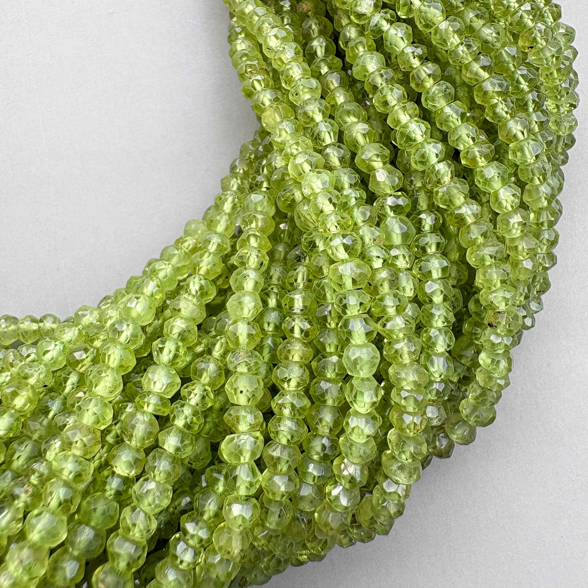 Natural peridot 3.5–4mm faceted beads on a 13-inch strand