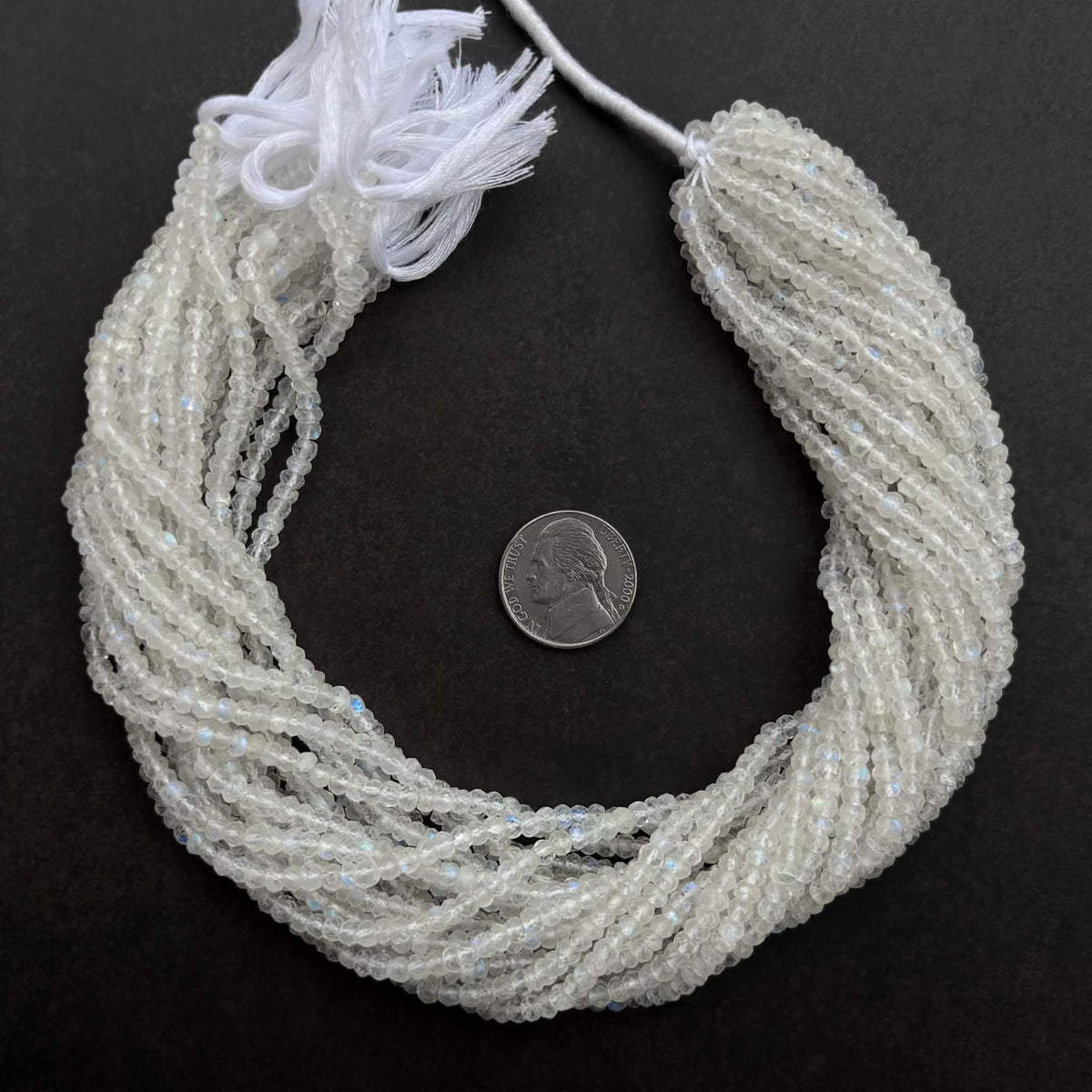 Natural rainbow moonstone beads with blue flash on 13-inch strand